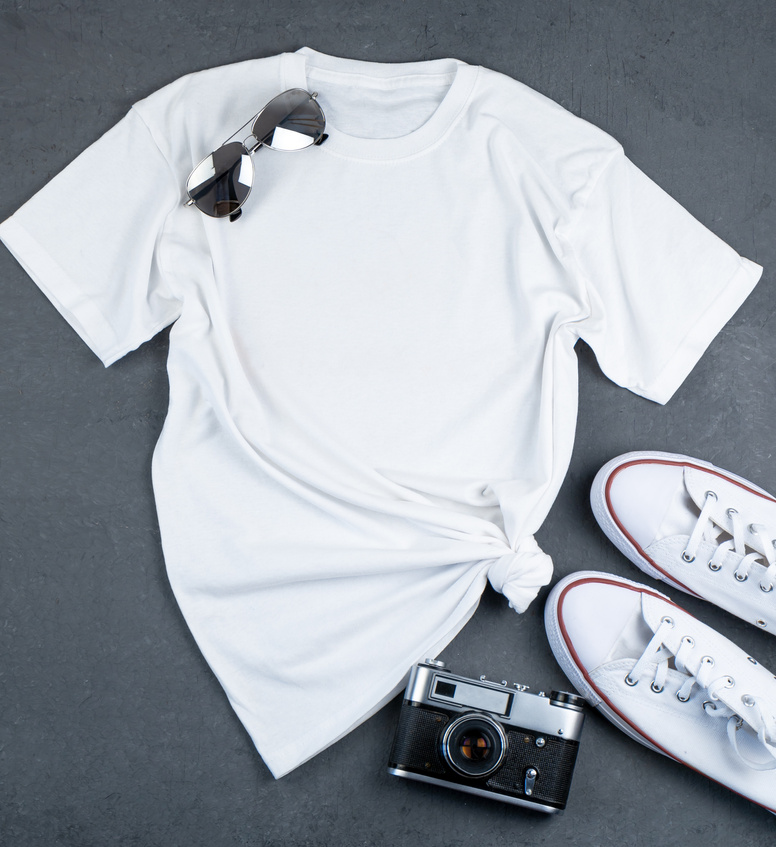 White T-Shirt with Place for Text. Sneakers, Glasses, Camera - a Set of Clothes for Walking. T-Shirt Mockup for Printing. Stylish Kit. Grey Background with Copy Space